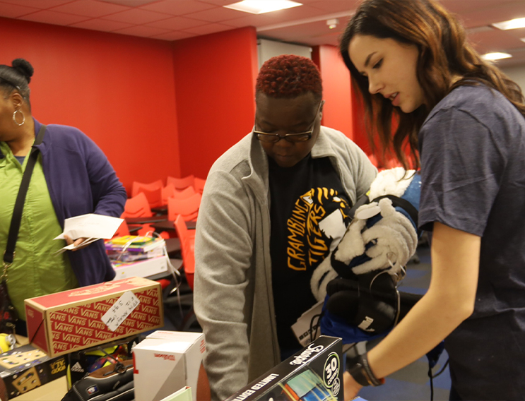 Team members passing out donated items