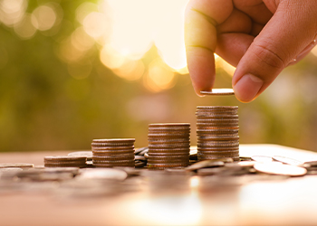 Person counting coins