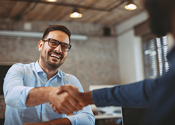 Entrepreneur shaking hands with financial planner