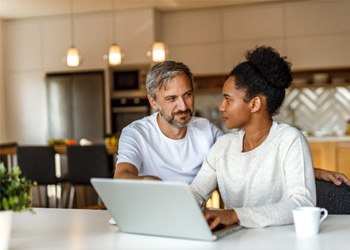 Couple discussing retirement planning in Irving