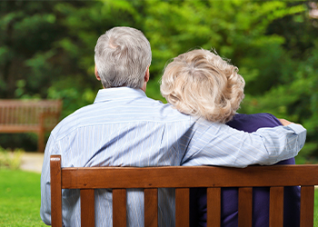 Older couple sitting together after legacy and estate planning