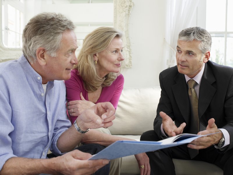 financial planner talking with clients 