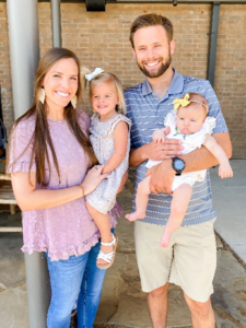 family of four smiling